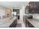 Modern kitchen with granite countertops and stainless steel appliances at 7236 Grand Elm Dr, Riverview, FL 33578