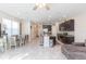 Open concept kitchen and living area with island at 7236 Grand Elm Dr, Riverview, FL 33578