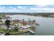 Aerial view of a waterfront property with a private pool, boat dock, and stunning water views at 7800 3Rd S Ave, St Petersburg, FL 33707