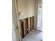 Entryway in disrepair with exposed studs and electrical wiring, alongside a textured glass door at 7800 3Rd S Ave, St Petersburg, FL 33707