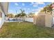 Landscaped backyard with shed and pool at 8334 139Th Ln, Seminole, FL 33776