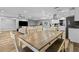 Casual dining area with a rustic wooden table and view into the living room at 8334 139Th Ln, Seminole, FL 33776