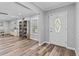 Bright and airy entryway with hardwood floors and built-in shelving at 8334 139Th Ln, Seminole, FL 33776