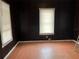 Bedroom with wood floors and dark wood walls at 1209 E Dr Martin Luther King Jr Blvd, Tampa, FL 33603