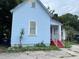 Light blue house with red steps, front yard, and partial street view at 1209 E Dr Martin Luther King Jr Blvd, Tampa, FL 33603