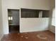 Living room with wood floors and open doorway at 1209 E Dr Martin Luther King Jr Blvd, Tampa, FL 33603