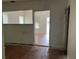 View of living room with hardwood floors and an open doorway at 1209 E Dr Martin Luther King Jr Blvd, Tampa, FL 33603