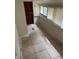 Sunroom with tiled floors and a door leading outside at 1209 E Dr Martin Luther King Jr Blvd, Tampa, FL 33603