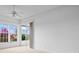 Bedroom with sliding doors to patio at 1209 Peridot Ln, Sun City Center, FL 33573