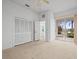 Bedroom with access to a bathroom and a patio at 1209 Peridot Ln, Sun City Center, FL 33573
