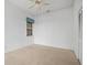 Spacious bedroom with carpeted floors and ceiling fan at 1209 Peridot Ln, Sun City Center, FL 33573