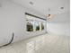 Bright dining area with tile floors and large windows at 1209 Peridot Ln, Sun City Center, FL 33573