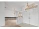 Bright entryway with white walls, tiled floors, and double doors at 1209 Peridot Ln, Sun City Center, FL 33573
