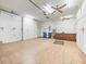 Spacious garage with ample storage and shelving at 1209 Peridot Ln, Sun City Center, FL 33573