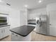 Kitchen with stainless steel refrigerator at 1209 Peridot Ln, Sun City Center, FL 33573