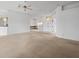 Spacious living area with carpeting and multiple windows at 1209 Peridot Ln, Sun City Center, FL 33573
