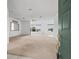 Spacious living room with carpeted floors and large windows at 1209 Peridot Ln, Sun City Center, FL 33573