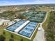 Expansive pickleball courts with covered seating at 1209 Peridot Ln, Sun City Center, FL 33573