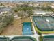 Aerial view of tennis courts and surrounding landscape at 1209 Peridot Ln, Sun City Center, FL 33573