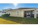 Backyard with screened patio and grassy area at 12410 Ballentrae Forest Dr, Riverview, FL 33579