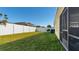Backyard with fenced area and grassy lawn at 12410 Ballentrae Forest Dr, Riverview, FL 33579