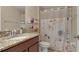 Small bathroom with shower/tub combo and floral shower curtain at 12410 Ballentrae Forest Dr, Riverview, FL 33579