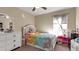 Bedroom with full bed, white dresser, and toys at 12410 Ballentrae Forest Dr, Riverview, FL 33579