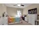 Bedroom with full-size bed, dresser, and window at 12410 Ballentrae Forest Dr, Riverview, FL 33579