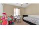 bedroom with bed, desk, and plenty of toys at 12410 Ballentrae Forest Dr, Riverview, FL 33579