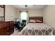 Bedroom with dresser, desk, and a double bed at 12410 Ballentrae Forest Dr, Riverview, FL 33579