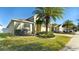 House exterior showcasing a two-story home with palm trees at 12410 Ballentrae Forest Dr, Riverview, FL 33579