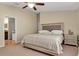 Spacious main bedroom with king-size bed and ensuite bathroom access at 12410 Ballentrae Forest Dr, Riverview, FL 33579