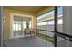 Cozy screened patio with two chairs at 12410 Ballentrae Forest Dr, Riverview, FL 33579