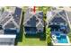 Aerial view showcasing home with solar panels and pool at 19510 Whispering Brook Dr, Tampa, FL 33647