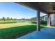 Covered patio overlooking a tranquil lake at 19510 Whispering Brook Dr, Tampa, FL 33647
