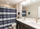 Bathroom boasts double vanity and shower/tub combo at 19510 Whispering Brook Dr, Tampa, FL 33647