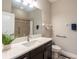 Bathroom with vanity, shower, and grab bars at 19510 Whispering Brook Dr, Tampa, FL 33647