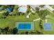 Aerial view of community tennis and basketball courts at 19510 Whispering Brook Dr, Tampa, FL 33647