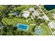 Aerial view of community pool, tennis, and basketball courts at 19510 Whispering Brook Dr, Tampa, FL 33647