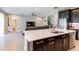 Modern kitchen with island, stainless steel appliances, and open to living area at 19510 Whispering Brook Dr, Tampa, FL 33647