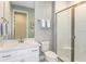 Modern bathroom with white vanity, shower, and toilet at 20249 Symphony Pl, Venice, FL 34293