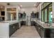Modern community kitchen with stainless steel appliances and granite countertops at 20249 Symphony Pl, Venice, FL 34293