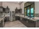 Modern community kitchen with stainless steel appliances and granite countertops at 20249 Symphony Pl, Venice, FL 34293