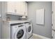 Laundry room with Whirlpool washer and dryer at 20249 Symphony Pl, Venice, FL 34293