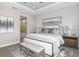 Main bedroom with king-size bed, ensuite bathroom and ample natural light at 20249 Symphony Pl, Venice, FL 34293