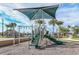 playground with shaded play structure and slides at 20249 Symphony Pl, Venice, FL 34293