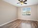 Bright bedroom with hardwood floors and a large window at 2029 Inverness Greens Dr # 2029, Sun City Center, FL 33573