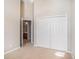 Bedroom with double doors and ensuite bathroom at 2029 Inverness Greens Dr # 2029, Sun City Center, FL 33573