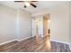 Bedroom with hardwood floors and ceiling fan at 2029 Inverness Greens Dr # 2029, Sun City Center, FL 33573