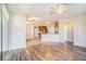 Open concept living room, kitchen and hardwood floors at 2029 Inverness Greens Dr # 2029, Sun City Center, FL 33573